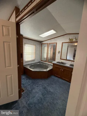 a view of mini theater with wooden floor