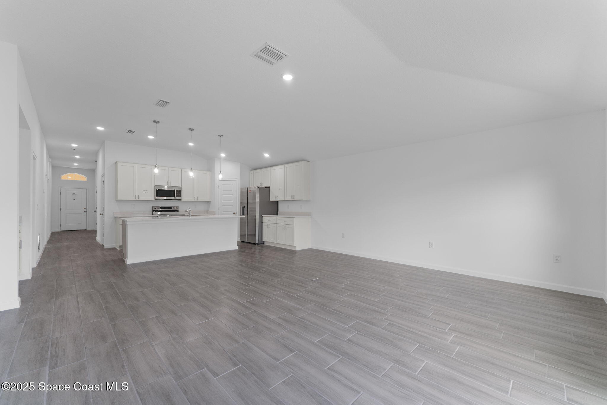 101 Crosspoint Street Southeast Palm Bay, FL 32909 - Photo 12 of 28 a view of a kitchen with a sink and a microwave