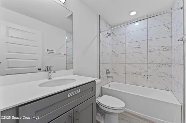 a bathroom with a sink a toilet and a bathtub