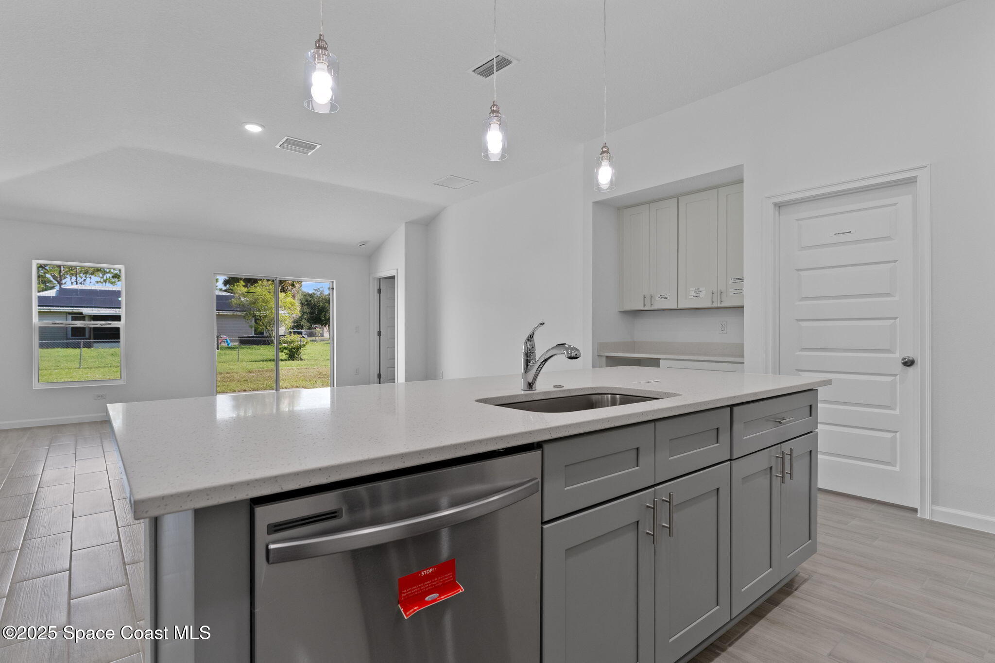 101 Crosspoint Street Southeast Palm Bay, FL 32909 - Photo 7 of 28 a kitchen with a sink and cabinets