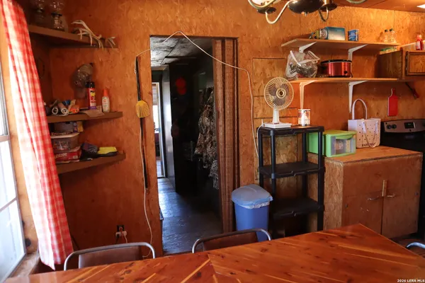 a view of entryway with a window and wooden floor