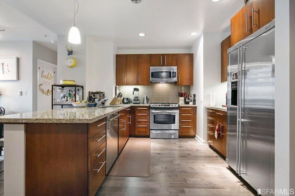 When you enter, the kitchen is on the right. Notice the beautiful, updated flooring.