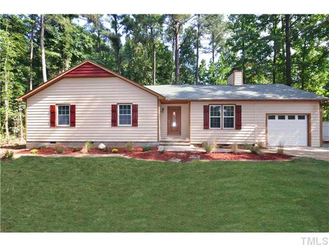 11420 Leesville Road Raleigh, NC 27613 - Photo 1 of 22 a front view of a house with a yard and garage
