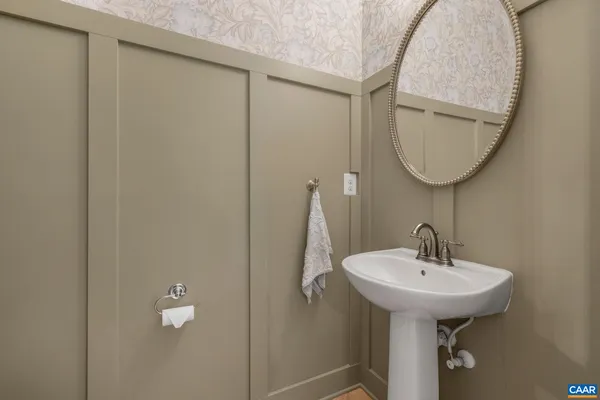 a bathroom with a sink and toilet