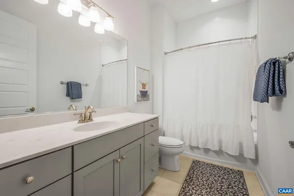 a view of a dining room with furniture and a potted plant