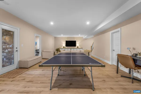 a backyard of a house with barbeque oven and outdoor seating