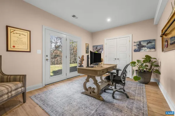 a front view of a house with garden and outdoor seating