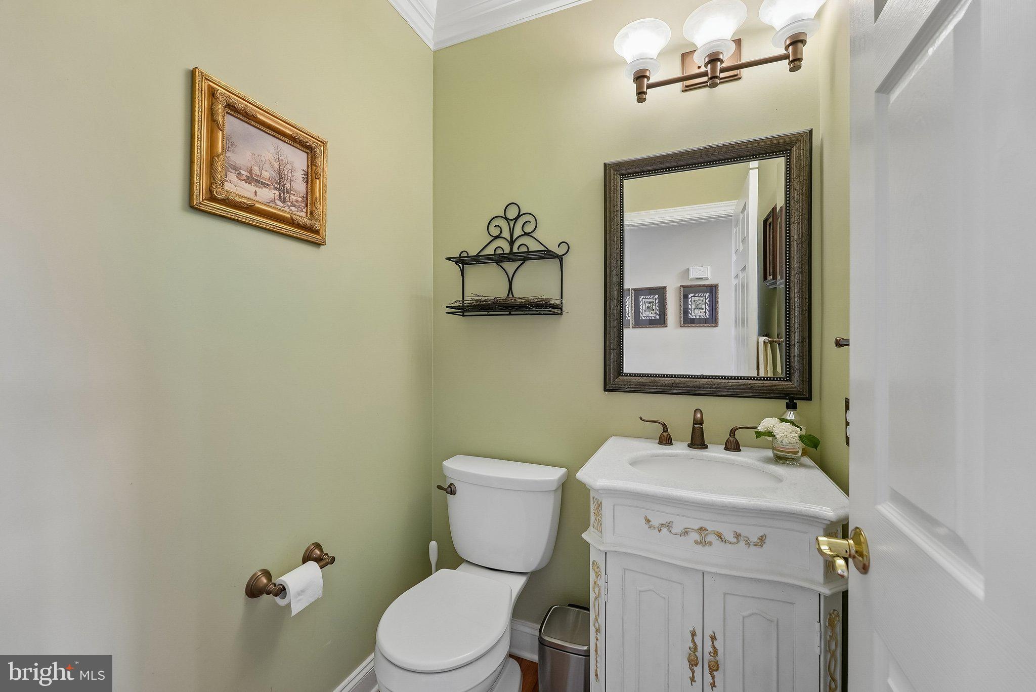 1 Baker Way Pennington, NJ 08534 - Photo 21 of 77 a bathroom with a toilet sink vanity and mirror