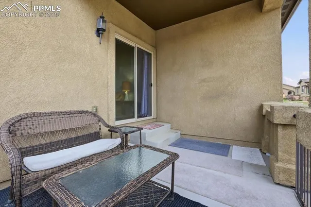 a living room with furniture and a window