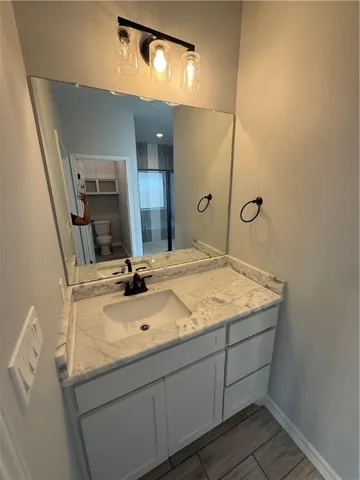 a bathroom with a toilet and a window