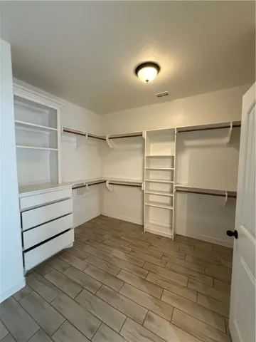 a view of a room with closet and natural light