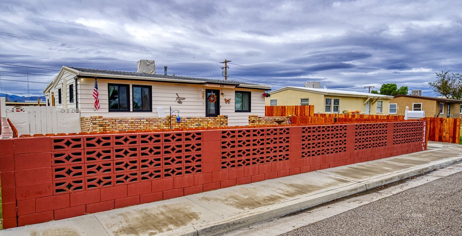 413 North Helena Street Ridgecrest, CA 93555 - Photo 1 of 42 a front view of a house with a yard
