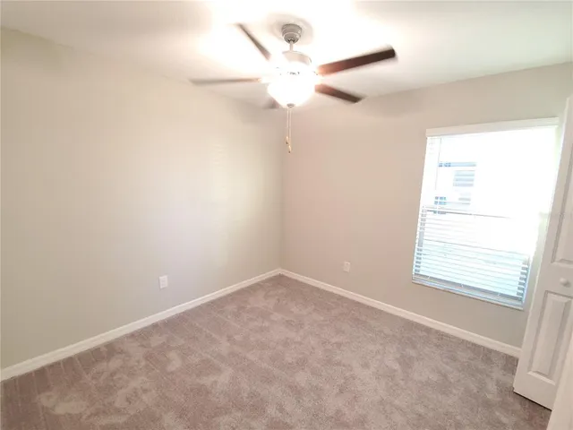 an empty room with a bathroom