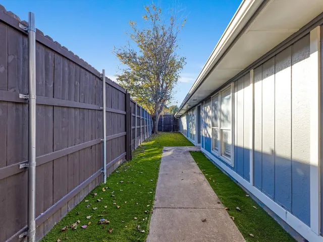 a front view of house with yard and outdoor seating