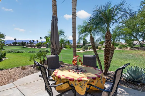 a view of a patio with garden