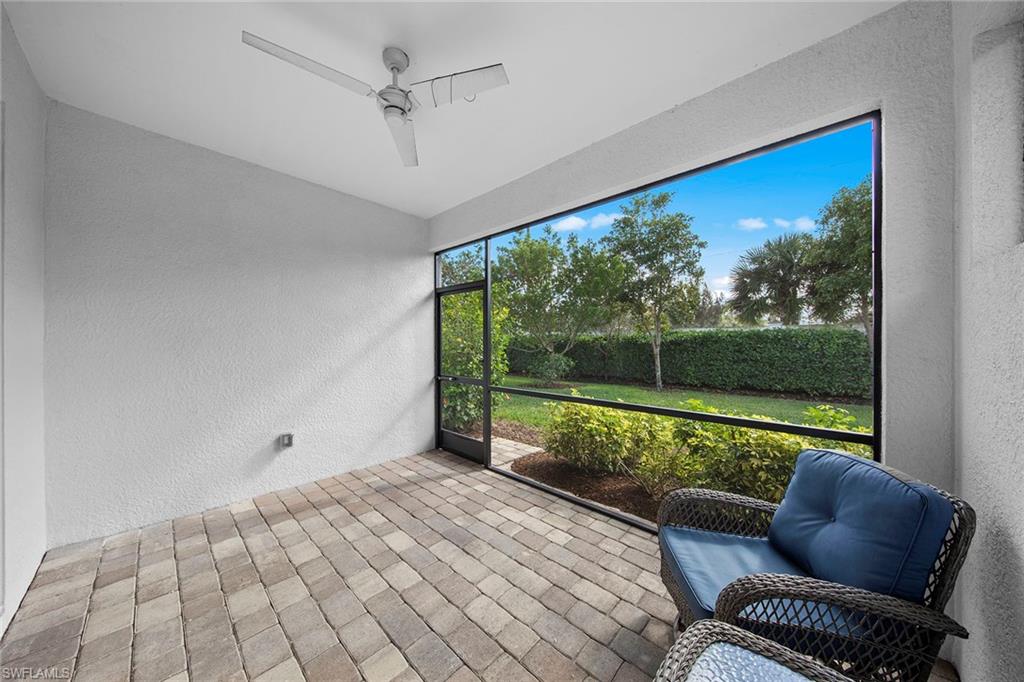 28419 Captiva Shell Loop Bonita Springs, FL 34135 - Photo 22 of 41 a room with furniture and a large window