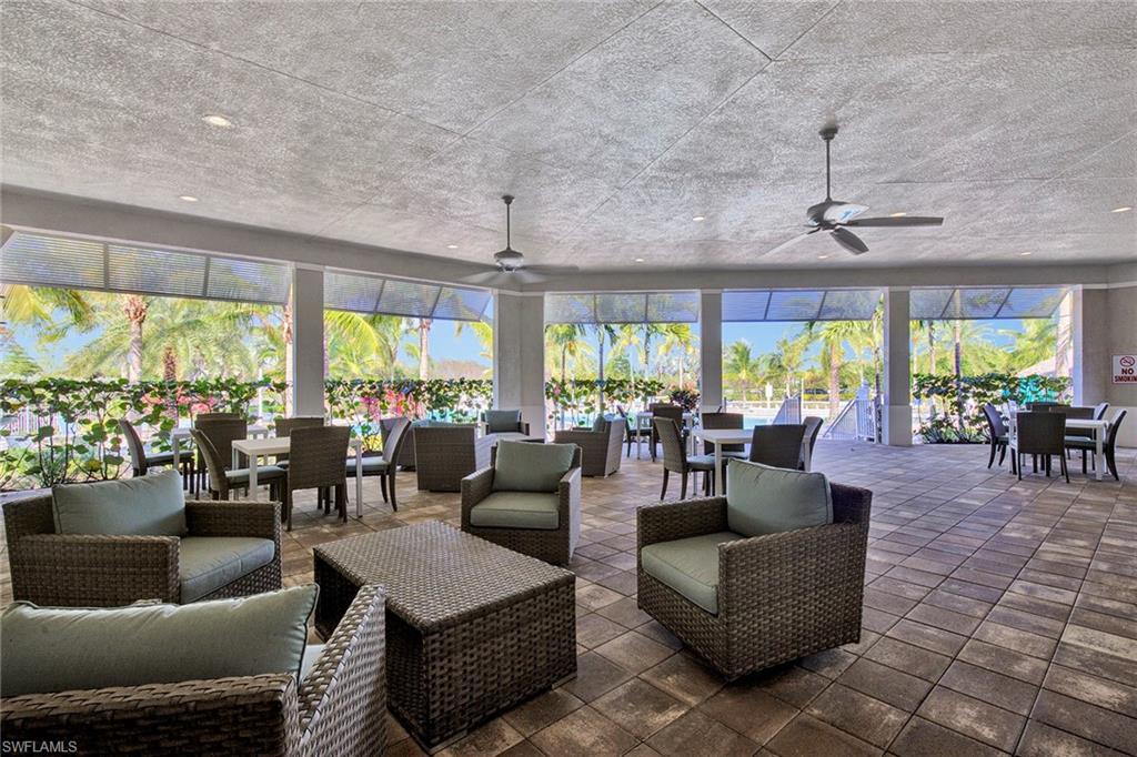 28419 Captiva Shell Loop Bonita Springs, FL 34135 - Photo 30 of 41 a living room with furniture and a large window