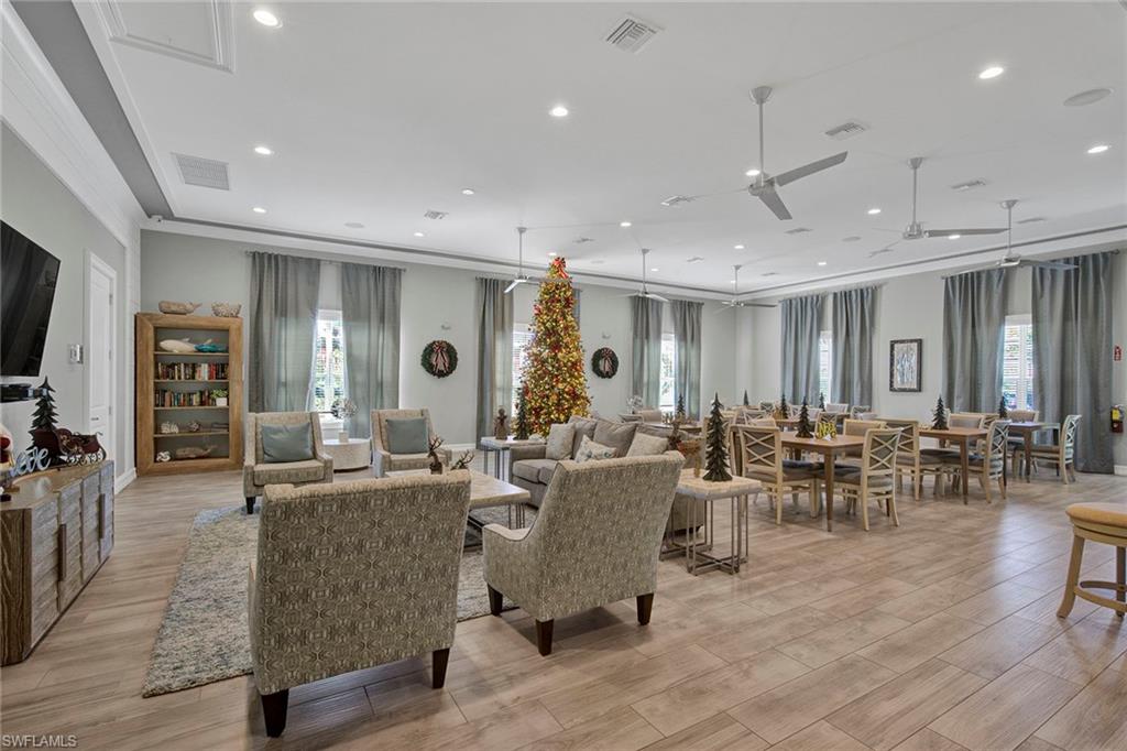 28419 Captiva Shell Loop Bonita Springs, FL 34135 - Photo 31 of 41 a living room with lots of furniture and view of kitchen