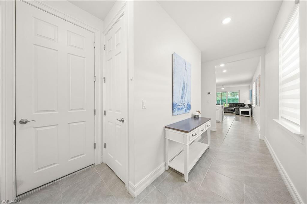 28419 Captiva Shell Loop Bonita Springs, FL 34135 - Photo 5 of 41 a hall with white cabinets