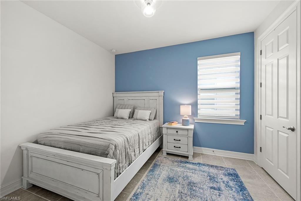 28419 Captiva Shell Loop Bonita Springs, FL 34135 - Photo 6 of 41 a bedroom with a bed and a window