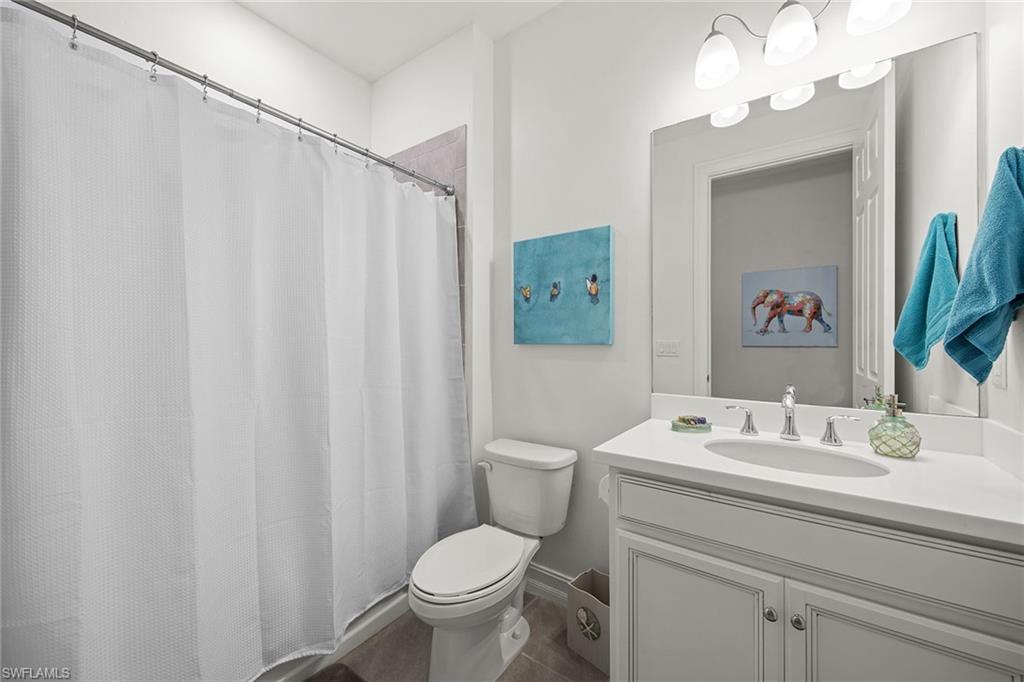 28419 Captiva Shell Loop Bonita Springs, FL 34135 - Photo 8 of 41 a bathroom with a sink vanity mirror and toilet