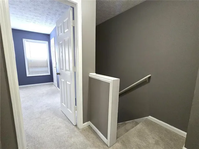 a view of a hallway with closet