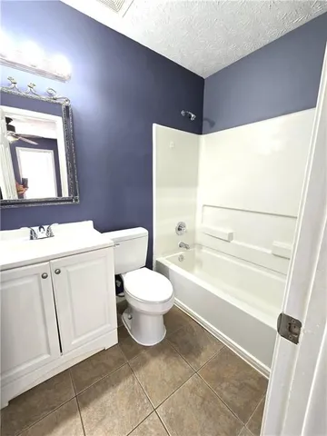 a bathroom with a toilet sink and a bathtub