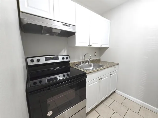 a kitchen with a stove and a microwave