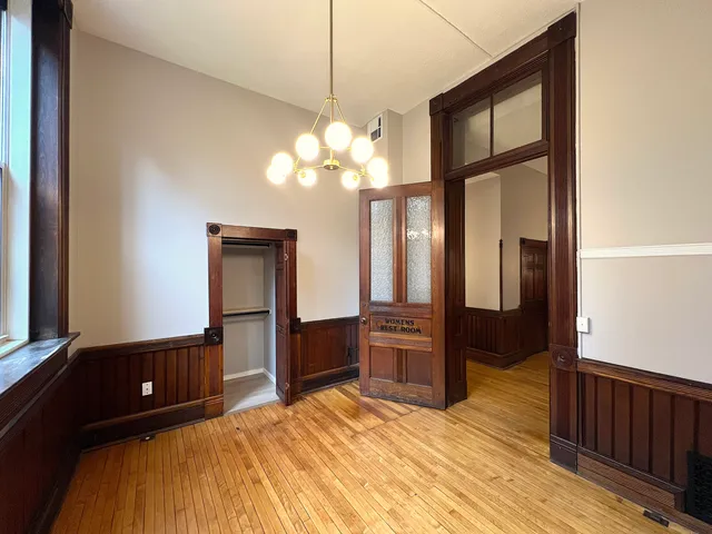 a bedroom with a bed dresser and a window