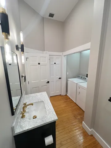 a bathroom with a sink and mirror