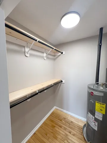 a view of a room with wooden floor