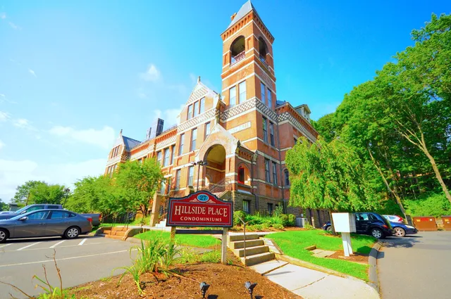 a view of street with parked cars