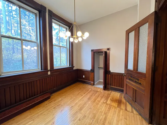 a bedroom with furniture and window