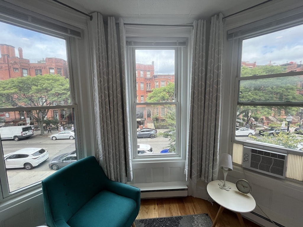 302 Newbury Street, Unit 7 Boston, MA 02115 - Photo 2 of 6 a living room with furniture and a window