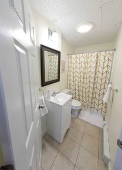 302 Newbury Street, Unit 7 Boston, MA 02115 - Photo 5 of 6 a bathroom with a sink a toilet and shower