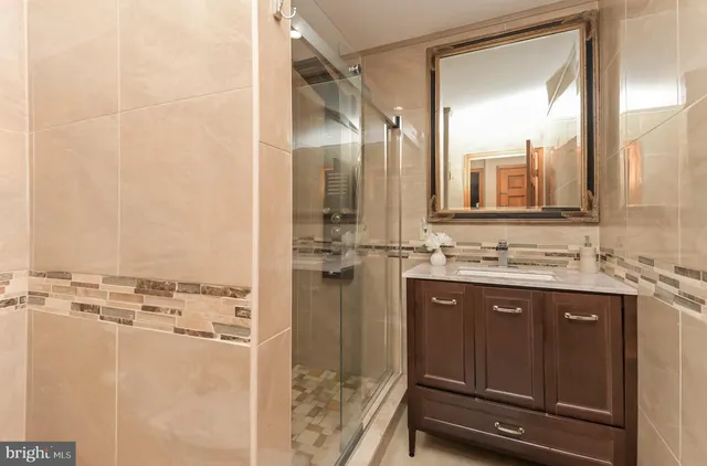 a bathroom with a sink and mirror