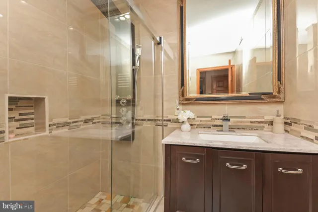 a bathroom with a sink double vanity and a mirror
