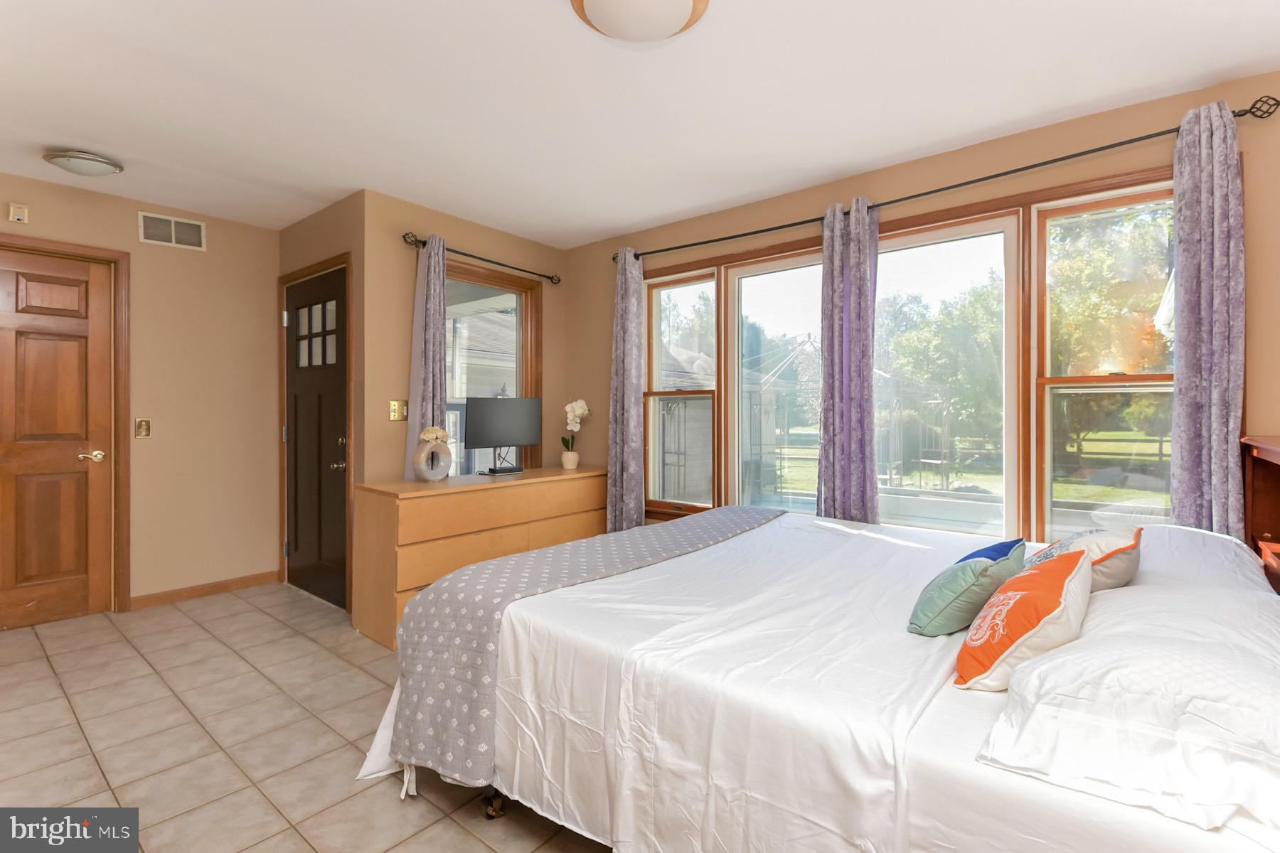 467 Gordon Road Robbinsville, NJ 08691 - Photo 19 of 41 a bedroom with a large bed and a large window