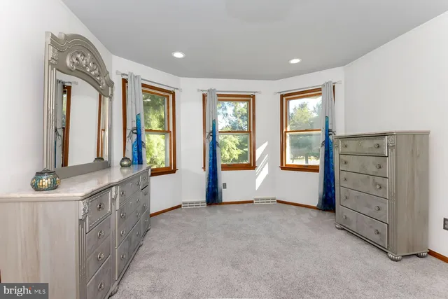 a view of room with window and furniture