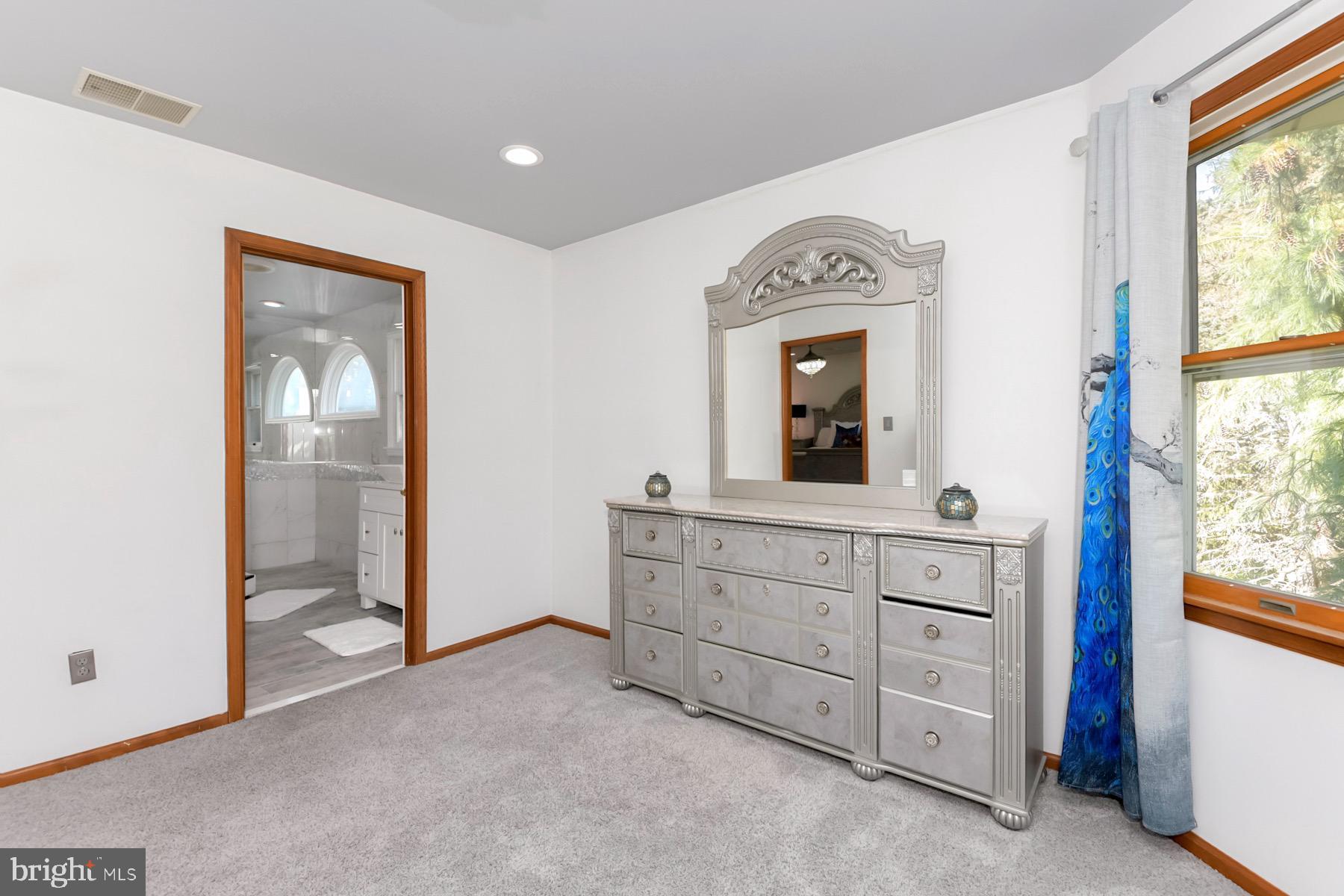 467 Gordon Road Robbinsville, NJ 08691 - Photo 28 of 41 a room with a bed mirror and a window