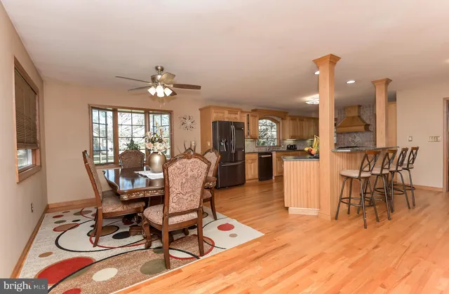 a view of a dining room with furniture window and wooden floor