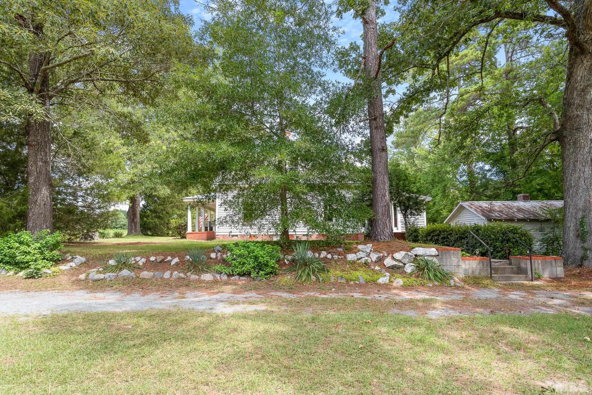 599 Federal Road Benson, NC 27504 - Photo 11 of 30 a view of a yard with plants and trees