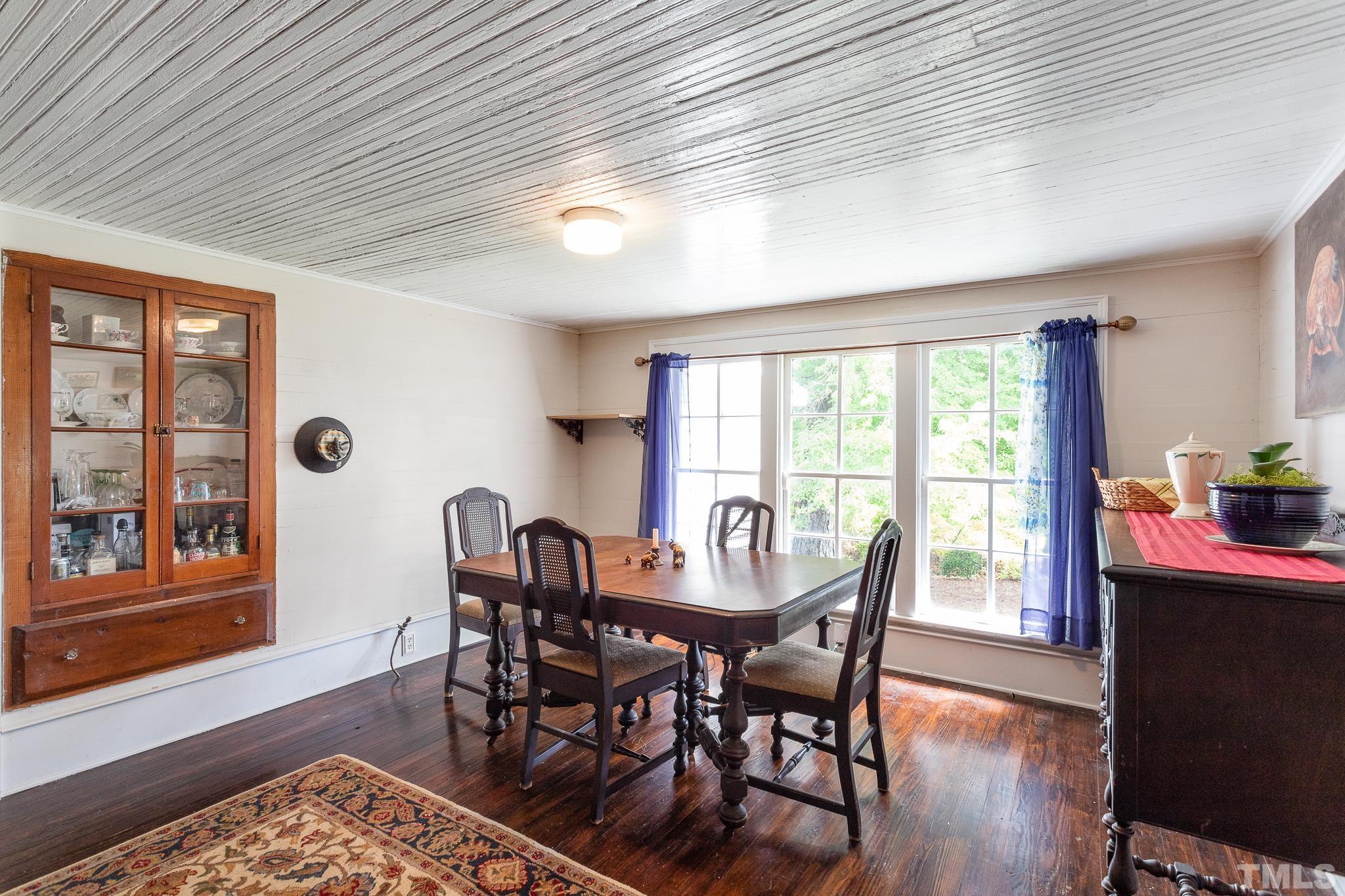 599 Federal Road Benson, NC 27504 - Photo 15 of 30 a dining room with furniture and wooden floor