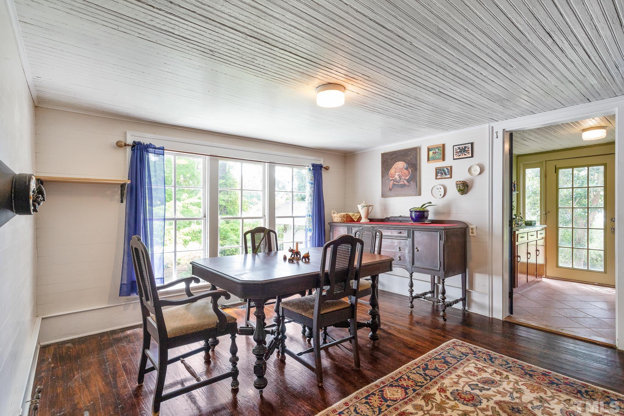 599 Federal Road Benson, NC 27504 - Photo 17 of 30 a view of a dining room with furniture window and wooden floor