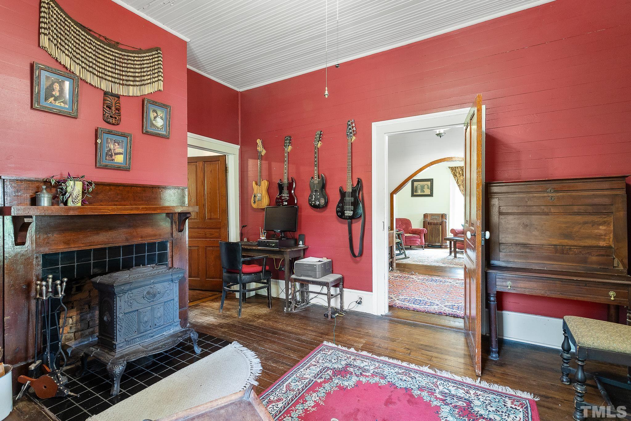 599 Federal Road Benson, NC 27504 - Photo 21 of 30 a living room with furniture and a fireplace