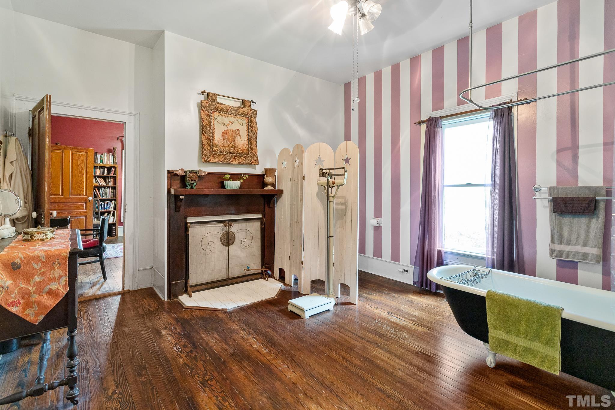 599 Federal Road Benson, NC 27504 - Photo 23 of 30 a living room with furniture a window and wooden floor