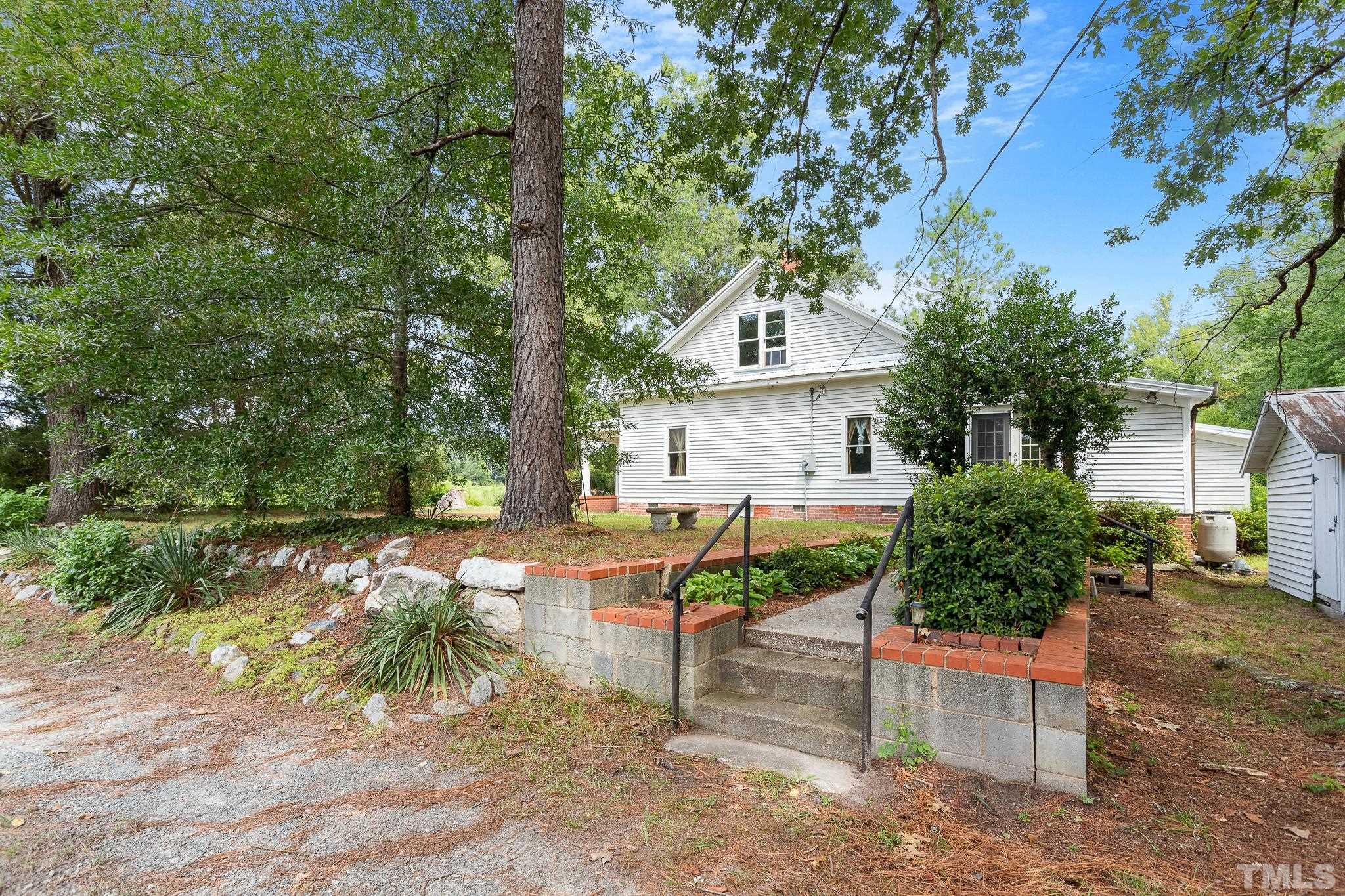 599 Federal Road Benson, NC 27504 - Photo 8 of 30 a front view of a house with a yard