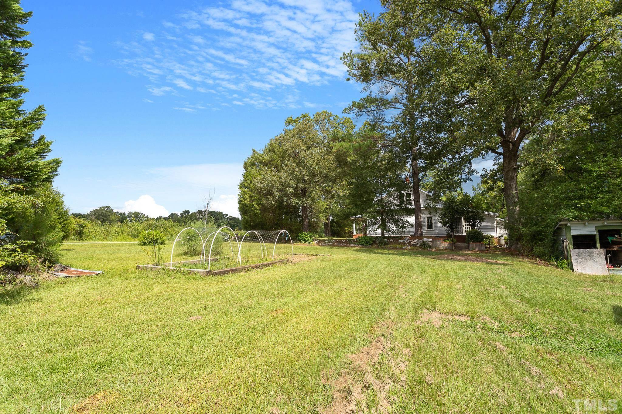 599 Federal Road Benson, NC 27504 - Photo 10 of 30 a view of yard with swimming pool and trees