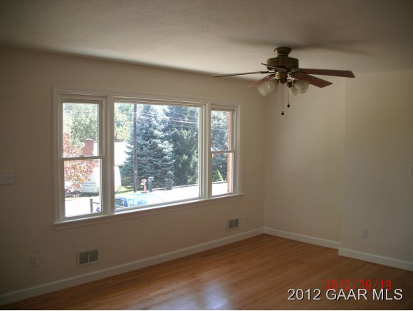 108 Nottingham Road Staunton, VA 24401 - Photo 3 of 13 wooden floor in an empty room with a window