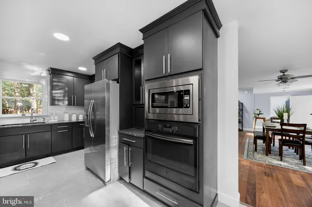 a view of a room with furniture and wooden floor